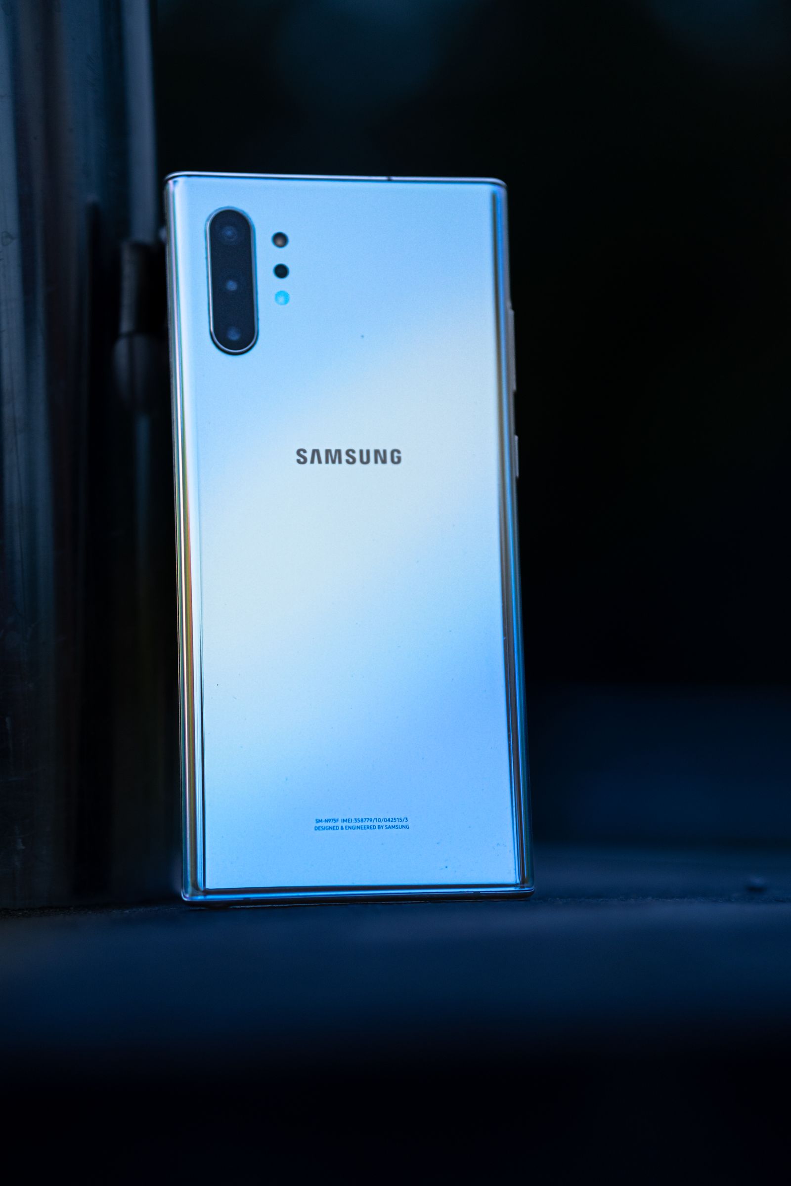Samsung Galaxy smartphone photographed against a dark blue background