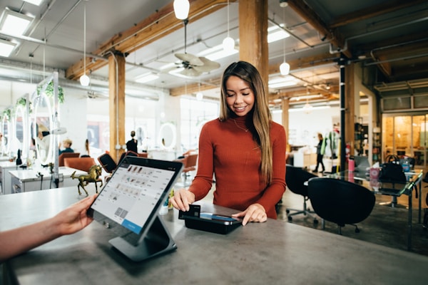 A customer making a purchase at a retail counter